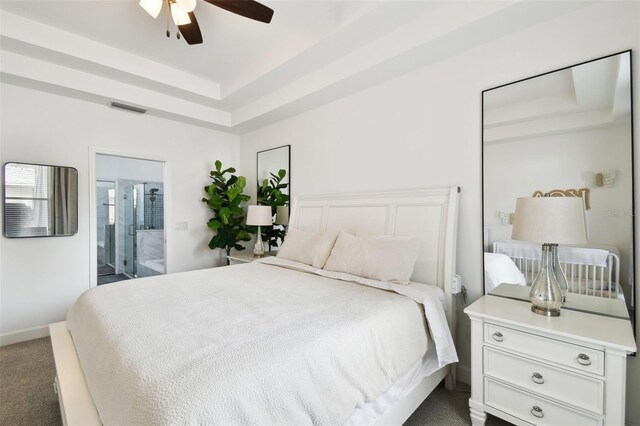 10011 Parley Dr, Tampa, FL 33626 - bedroom featuring ceiling fan, a tray ceiling, visible vents, carpet flooring, and baseboards
