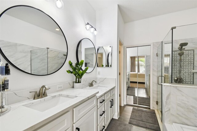 10011 Parley Dr, Tampa, FL 33626 - ensuite bathroom with a sink, a shower stall, double vanity, and ensuite bath