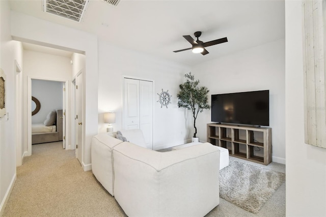10011 Parley Dr, Tampa, FL 33626 - carpeted living room with visible vents, baseboards, and a ceiling fan