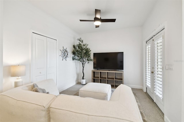 10011 Parley Dr, Tampa, FL 33626 - carpeted living room with baseboards and a ceiling fan