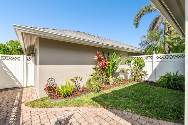 10011 Parley Dr, Tampa, FL 33626 - view of property exterior featuring a patio, stucco siding, fence, and a gate