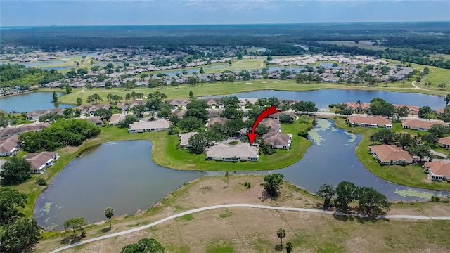 aerial view featuring a residential view, view of golf course, and a water view