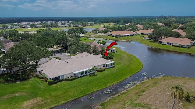 birds eye view of property featuring a residential view and a water view