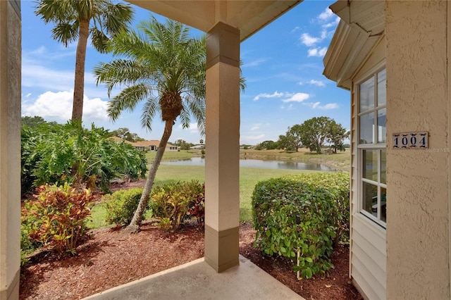exterior space with a patio and a water view