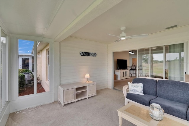 sunroom featuring ceiling fan, an outdoor hangout area, and visible vents