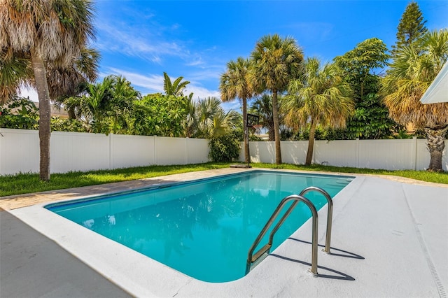 429 88th Ave, St Pete Beach, FL 33706 - view of swimming pool featuring a fenced backyard and a patio