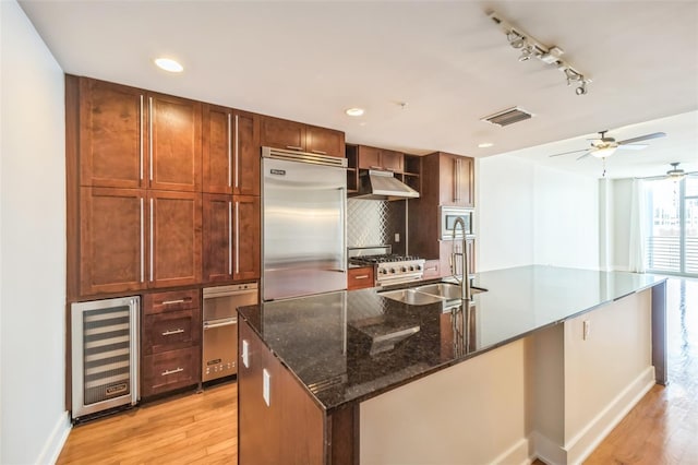1120 E Kennedy Blvd Unit 615, Tampa, FL 33602 - kitchen with visible vents, a sink, wine cooler, built in appliances, and baseboards