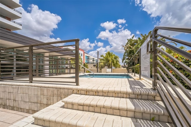 1120 E Kennedy Blvd Unit 615, Tampa, FL 33602 - wooden terrace with a fenced in pool and a patio