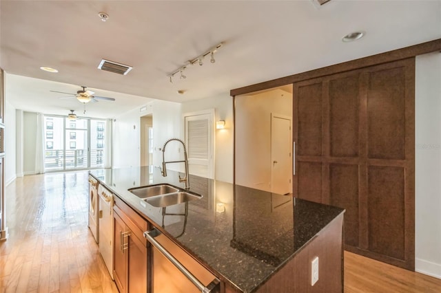 1120 E Kennedy Blvd Unit 615, Tampa, FL 33602 - kitchen with ceiling fan, stainless steel dishwasher, visible vents, a kitchen island with sink, and a sink