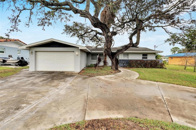 ranch-style house with concrete driveway, a front lawn, a garage, and stucco siding