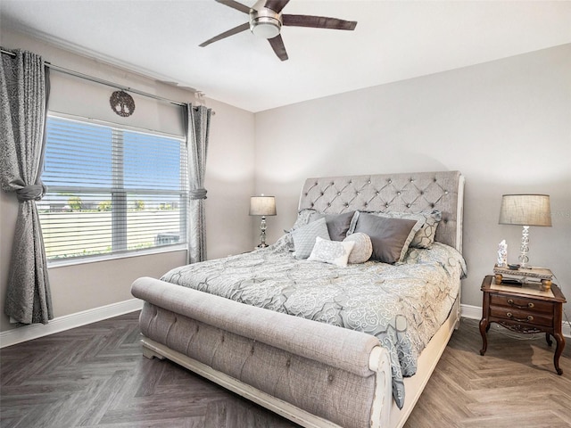 bedroom with a ceiling fan and baseboards