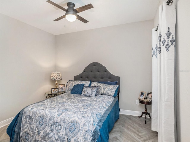 bedroom featuring a ceiling fan and baseboards