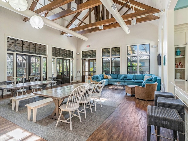 sunroom featuring french doors and beam ceiling