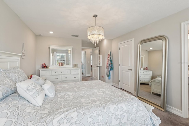 bedroom with visible vents, baseboards, a notable chandelier, and carpet floors