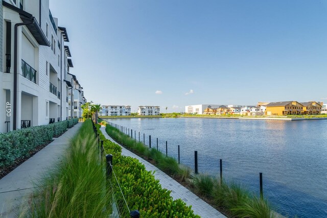 view of water feature with a residential view and a boat dock