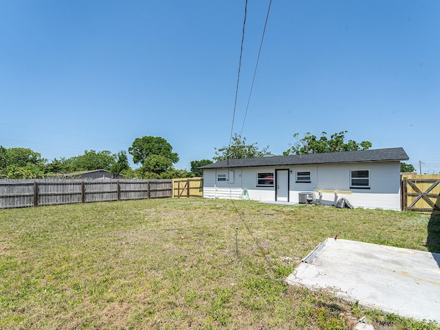exterior space with a patio, central AC unit, and a fenced backyard