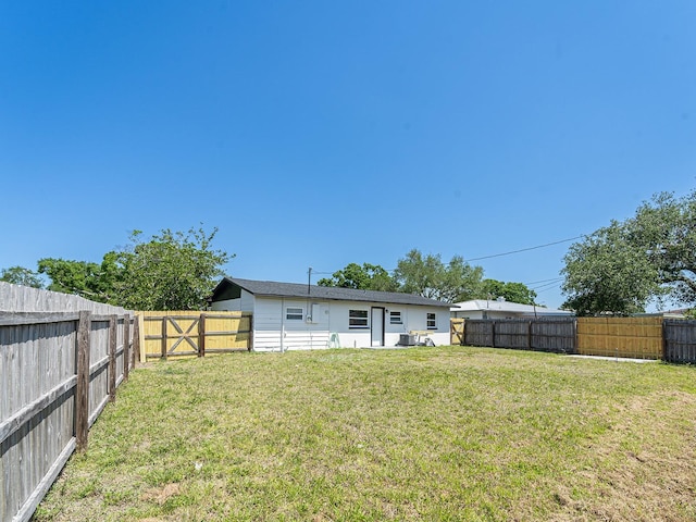 view of yard featuring a fenced backyard