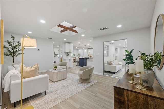 1905 Oro Ct, Clearwater, FL 33764 - living area featuring visible vents, a skylight, recessed lighting, and light wood-style floors