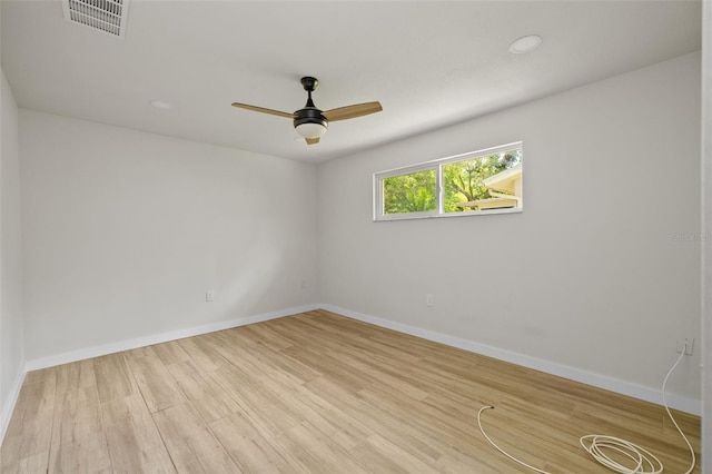 1905 Oro Ct, Clearwater, FL 33764 - unfurnished room featuring wood finished floors, ceiling fan, baseboards, and visible vents