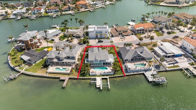 bird's eye view with a water view and a residential view