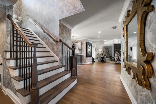 foyer featuring visible vents, recessed lighting, stairway, wood finished floors, and baseboards