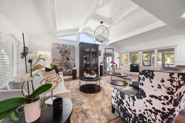 living room featuring wood finished floors and vaulted ceiling with beams