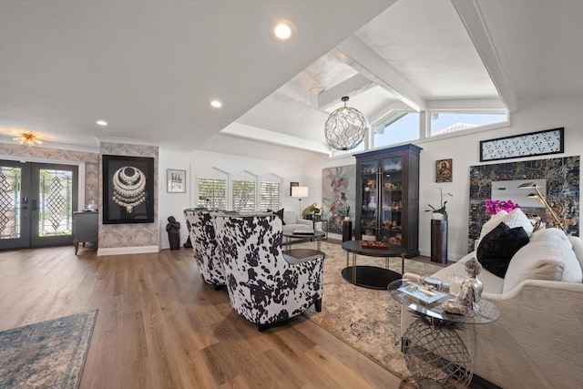 living room featuring french doors, baseboards, vaulted ceiling with beams, and wood finished floors