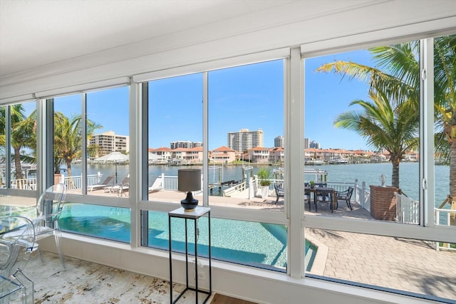 view of pool featuring a water view