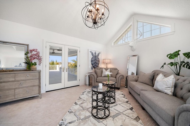 living room with high vaulted ceiling, a notable chandelier, french doors, and light colored carpet