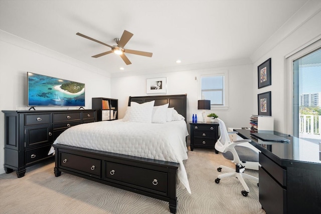 bedroom featuring crown molding, light colored carpet, and a ceiling fan