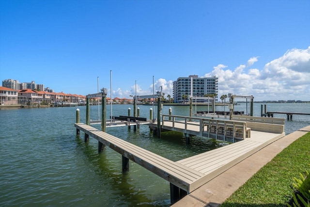 view of dock with boat lift and a water view