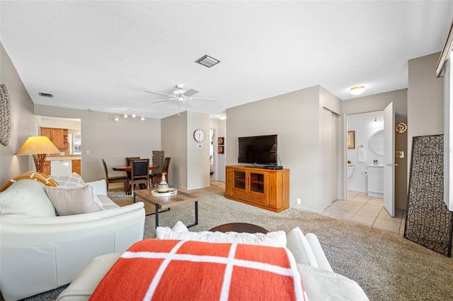 6920 Lafayette N Unit 6920, Pinellas Park, FL 33781 - living area featuring light colored carpet, baseboards, a ceiling fan, and visible vents