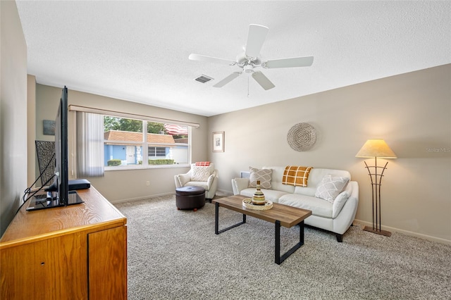 6920 Lafayette N Unit 6920, Pinellas Park, FL 33781 - living area with visible vents, baseboards, a ceiling fan, a textured ceiling, and carpet flooring