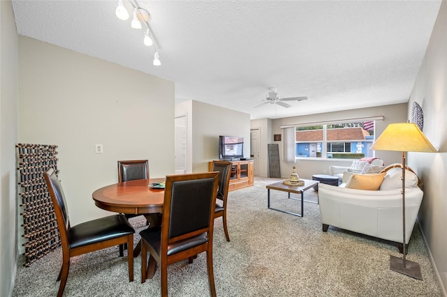 6920 Lafayette N Unit 6920, Pinellas Park, FL 33781 - dining room featuring track lighting, a textured ceiling, ceiling fan, and carpet floors