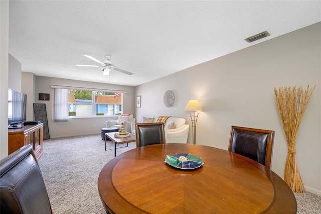6920 Lafayette N Unit 6920, Pinellas Park, FL 33781 - dining area featuring ceiling fan, carpet flooring, baseboards, and visible vents