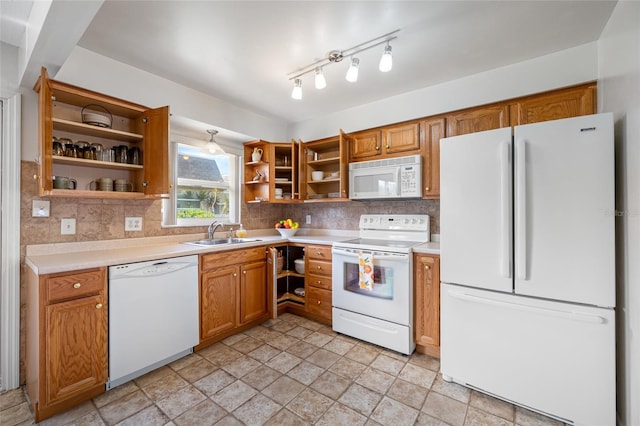 6920 Lafayette N Unit 6920, Pinellas Park, FL 33781 - kitchen with white appliances, light countertops, open shelves, decorative backsplash, and a sink