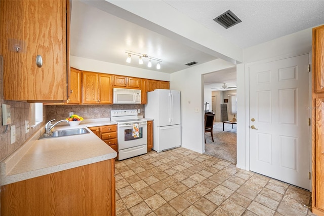 6920 Lafayette N Unit 6920, Pinellas Park, FL 33781 - kitchen featuring white appliances, stone finish floor, visible vents, light countertops, and a sink