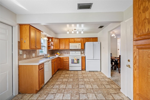 6920 Lafayette N Unit 6920, Pinellas Park, FL 33781 - kitchen with light countertops, a sink, white appliances, and visible vents