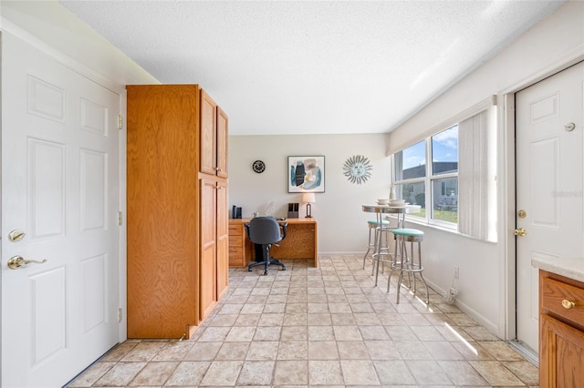 6920 Lafayette N Unit 6920, Pinellas Park, FL 33781 - office area featuring baseboards and a textured ceiling