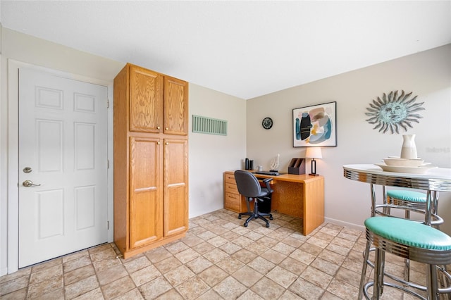 6920 Lafayette N Unit 6920, Pinellas Park, FL 33781 - office area featuring visible vents, baseboards, and stone finish flooring