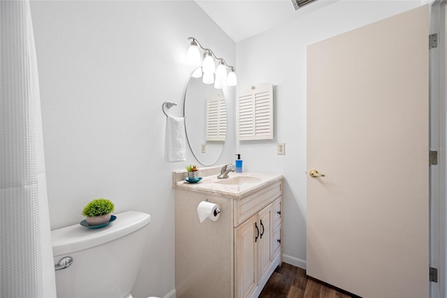 6920 Lafayette N Unit 6920, Pinellas Park, FL 33781 - bathroom with toilet, wood finished floors, and vanity