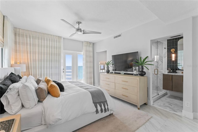 bedroom featuring visible vents, marble finish floor, ensuite bathroom, and ceiling fan