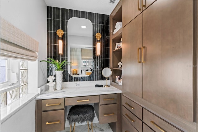 bathroom featuring vanity and plenty of natural light