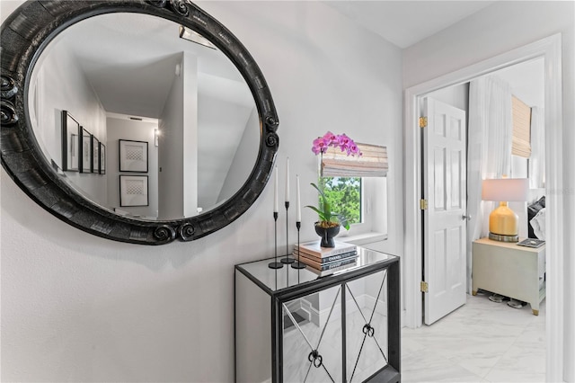 corridor with marble finish floor