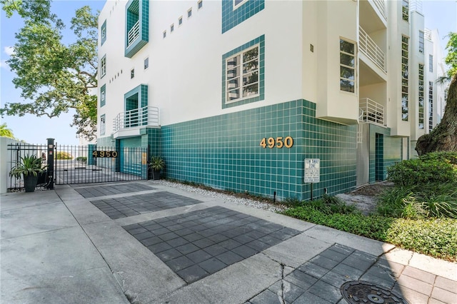 view of building exterior featuring fence