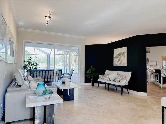 living area featuring crown molding, baseboards, and a sunroom