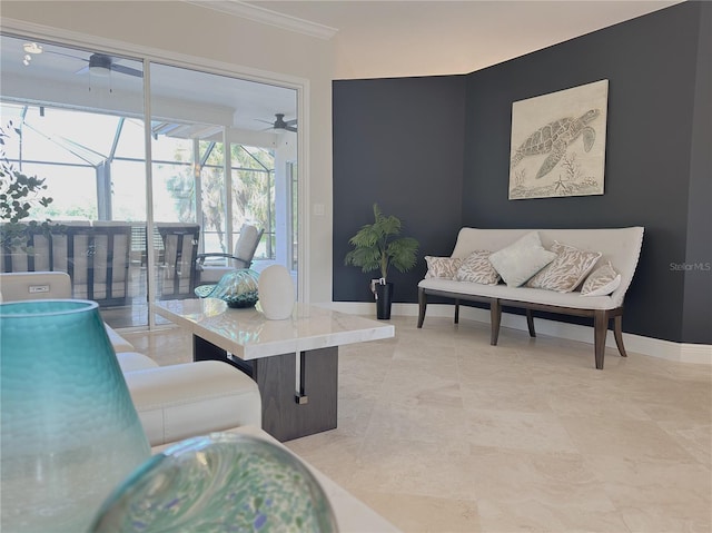 living room featuring crown molding, ceiling fan, a sunroom, and baseboards