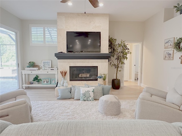 living room with recessed lighting, a tiled fireplace, ceiling fan, and wood finished floors