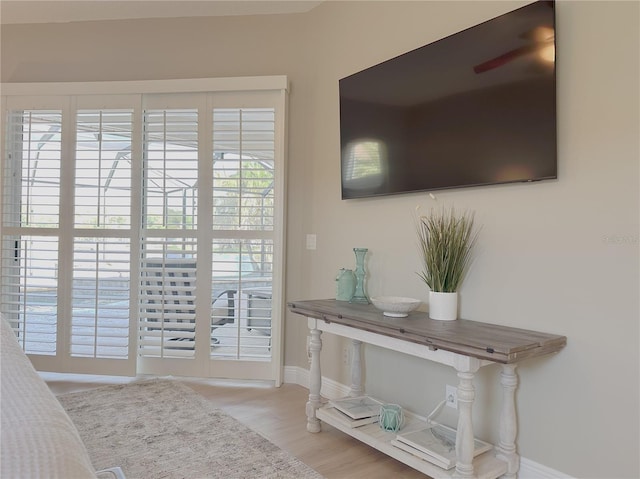bedroom featuring baseboards and wood finished floors