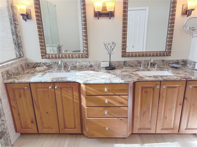 full bath with a sink and double vanity